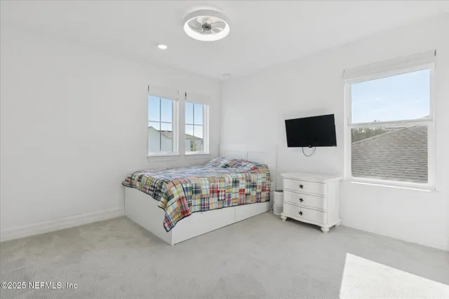a view of a large room with wooden floor and city view