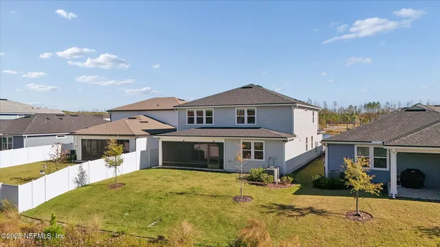 a aerial view of a house with a lake view