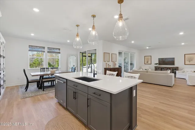 a dining room with furniture and wooden floor