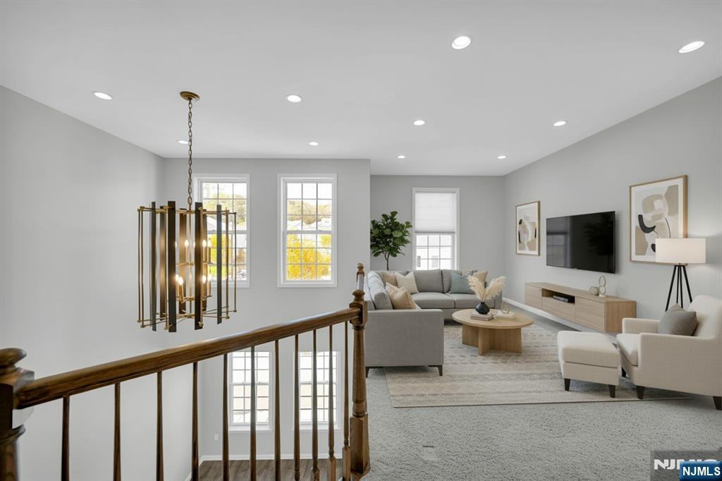 41 Sequoia Drive Cedar Grove, NJ 07009 - Photo 20 of 49 a living room with furniture and a flat screen tv