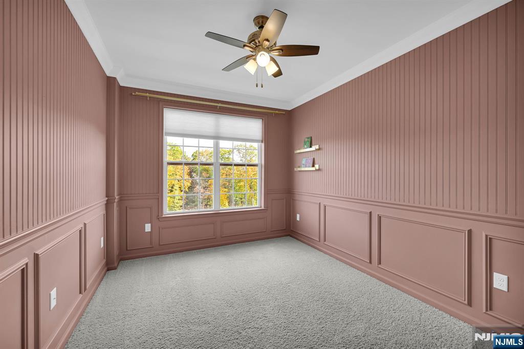 41 Sequoia Drive Cedar Grove, NJ 07009 - Photo 30 of 49 a view of an empty room with a window