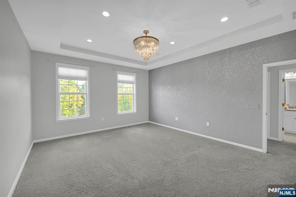 41 Sequoia Drive Cedar Grove, NJ 07009 - Photo 34 of 49 a view of an empty room with a window