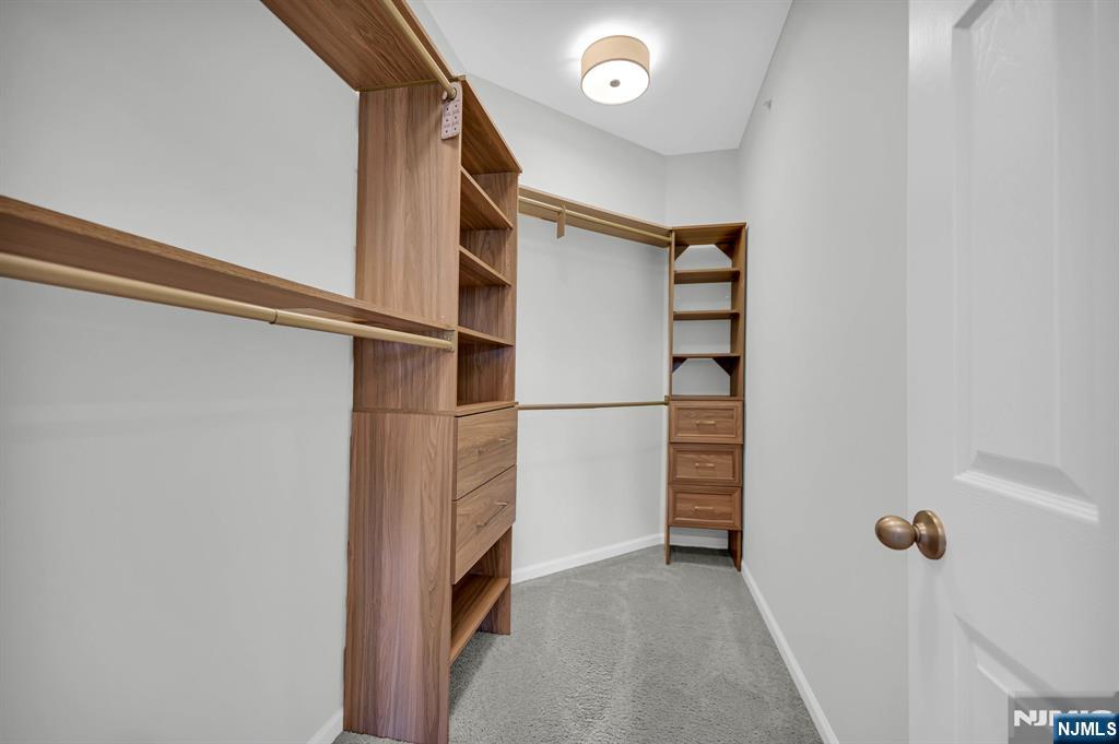 41 Sequoia Drive Cedar Grove, NJ 07009 - Photo 37 of 49 a view of walk in closet with empty racks