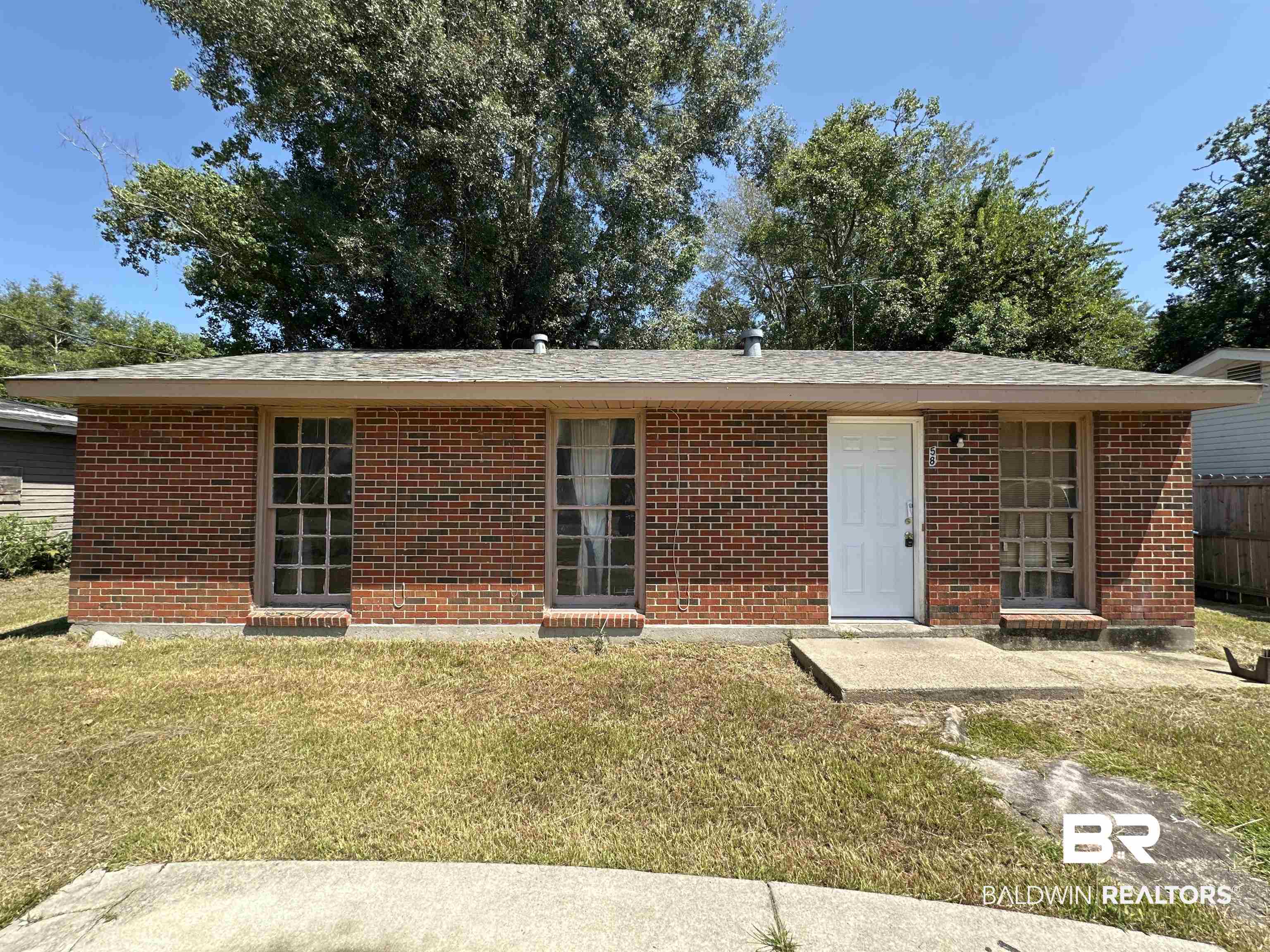 58 Chieftain Way Mobile, AL 36611 - Photo 1 of 12 View of front of property with a front lawn