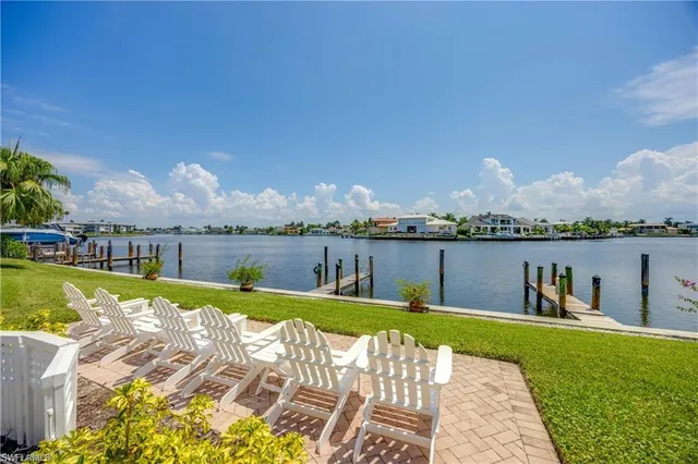 a view of a swimming pool and lounge chairs