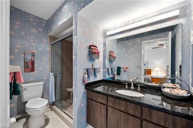 a room with a bed and a chandelier