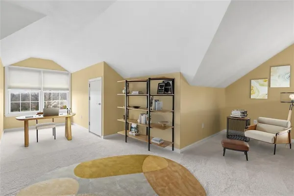 a living room with furniture rug and window