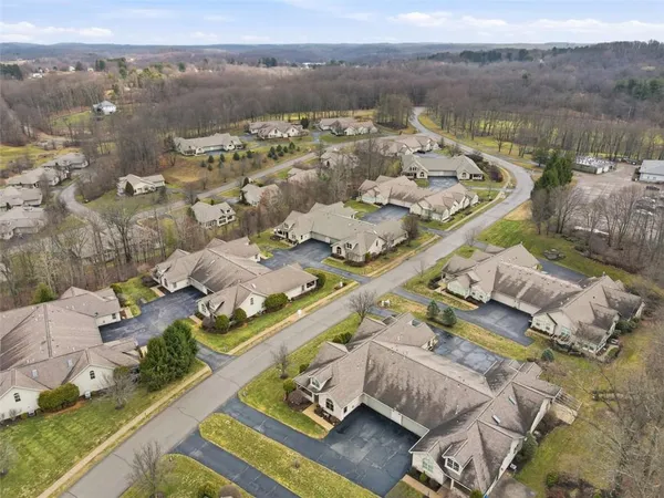 a view of a swimming pool with a yard