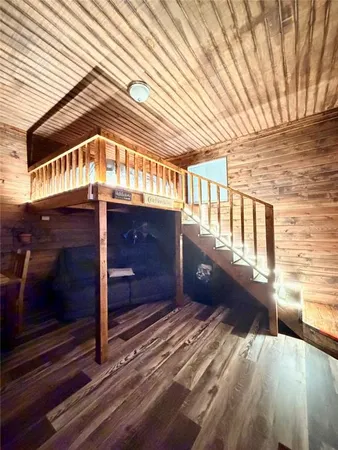 a view of a porch with wooden floor
