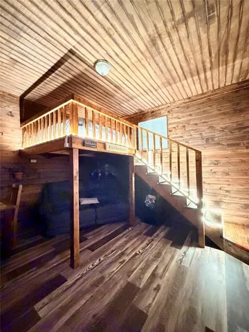 a view of a porch with wooden floor