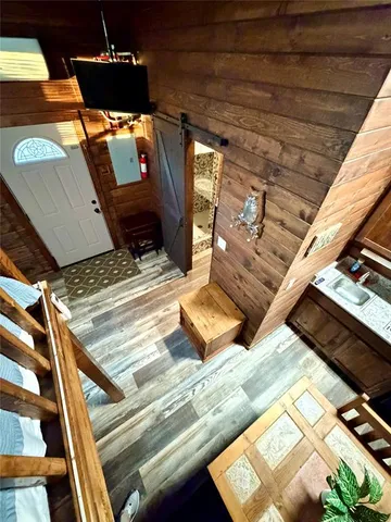 a view of living room with furniture and a fireplace