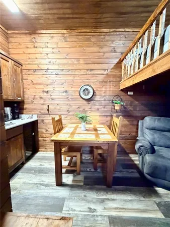 a kitchen with a table chairs and a stove
