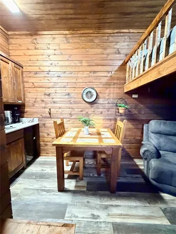a kitchen with a table chairs and a stove