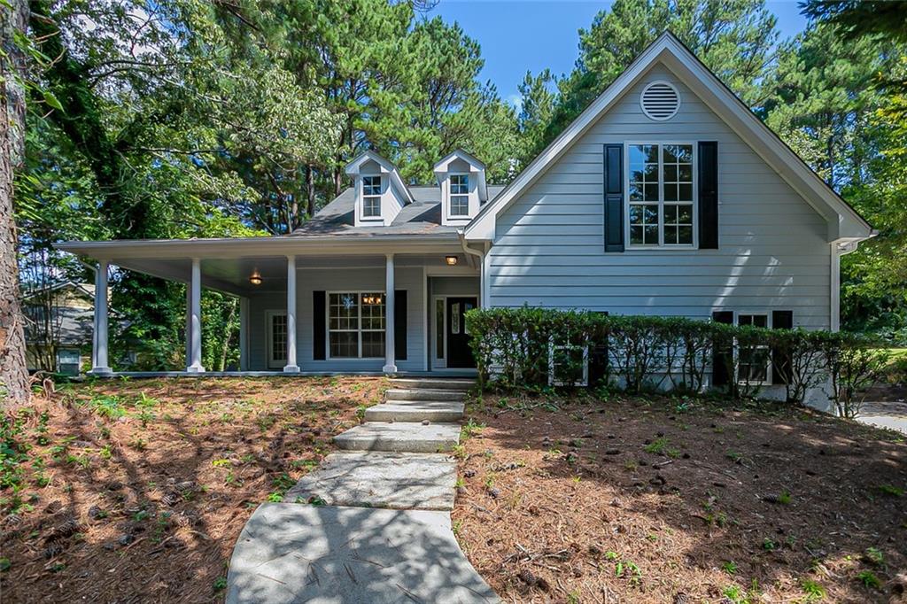 3295 Harvester Woods Road Decatur, GA 30034 - Photo 1 of 1 a front view of a house with a garden