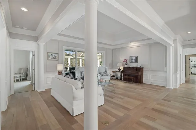 a kitchen with stainless steel appliances granite countertop a kitchen island a stove a table and chairs in it