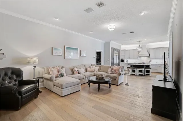 a spacious bathroom with a double vanity sink a large mirror and a bathtub