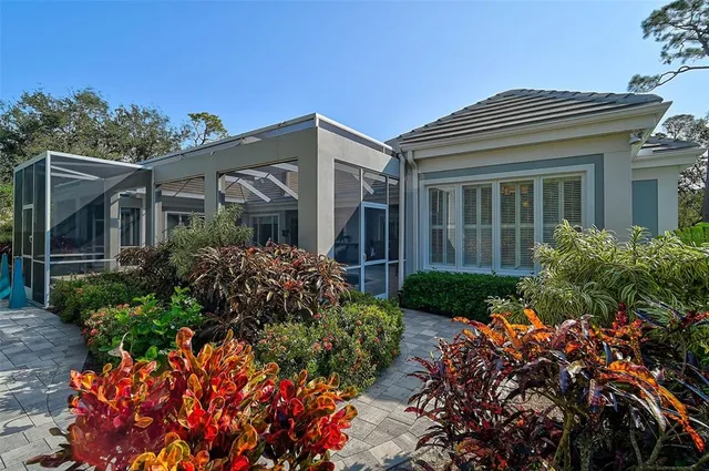 a dining room with furniture a rug and a chandelier