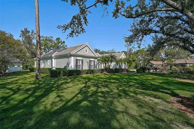a front view of a house with a yard and a garage