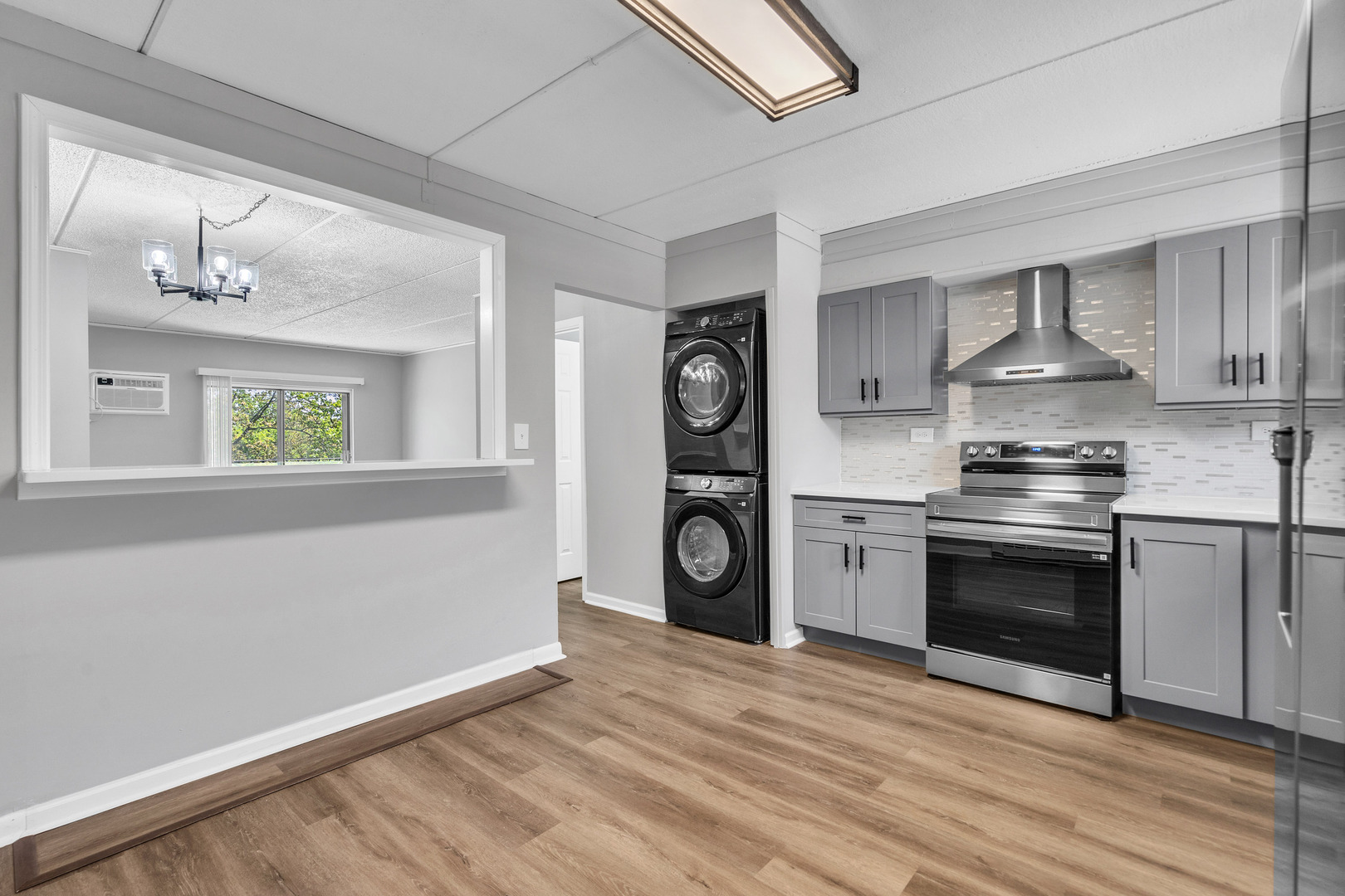 942 North Rohlwing Road, Unit 201E Addison, IL 60101 - Photo 14 of 25 a kitchen with a stove cabinets and a refrigerator