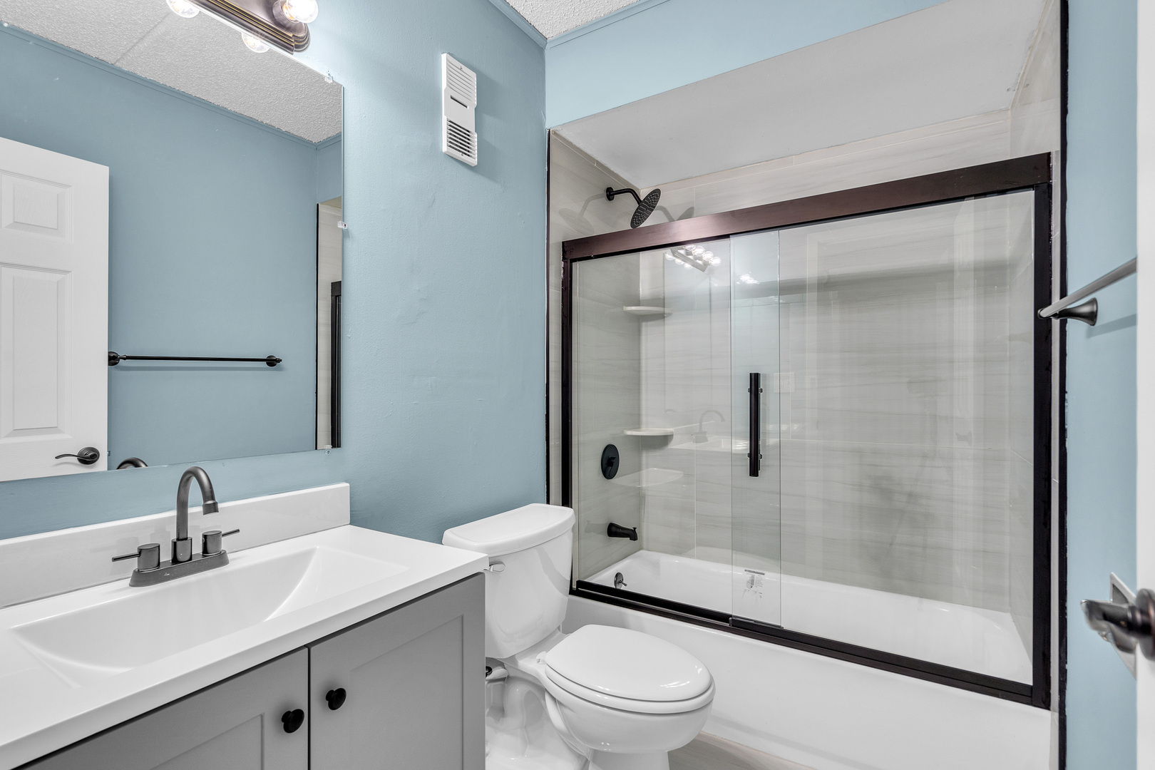 942 North Rohlwing Road, Unit 201E Addison, IL 60101 - Photo 17 of 25 a bathroom with a sink mirror toilet and shower
