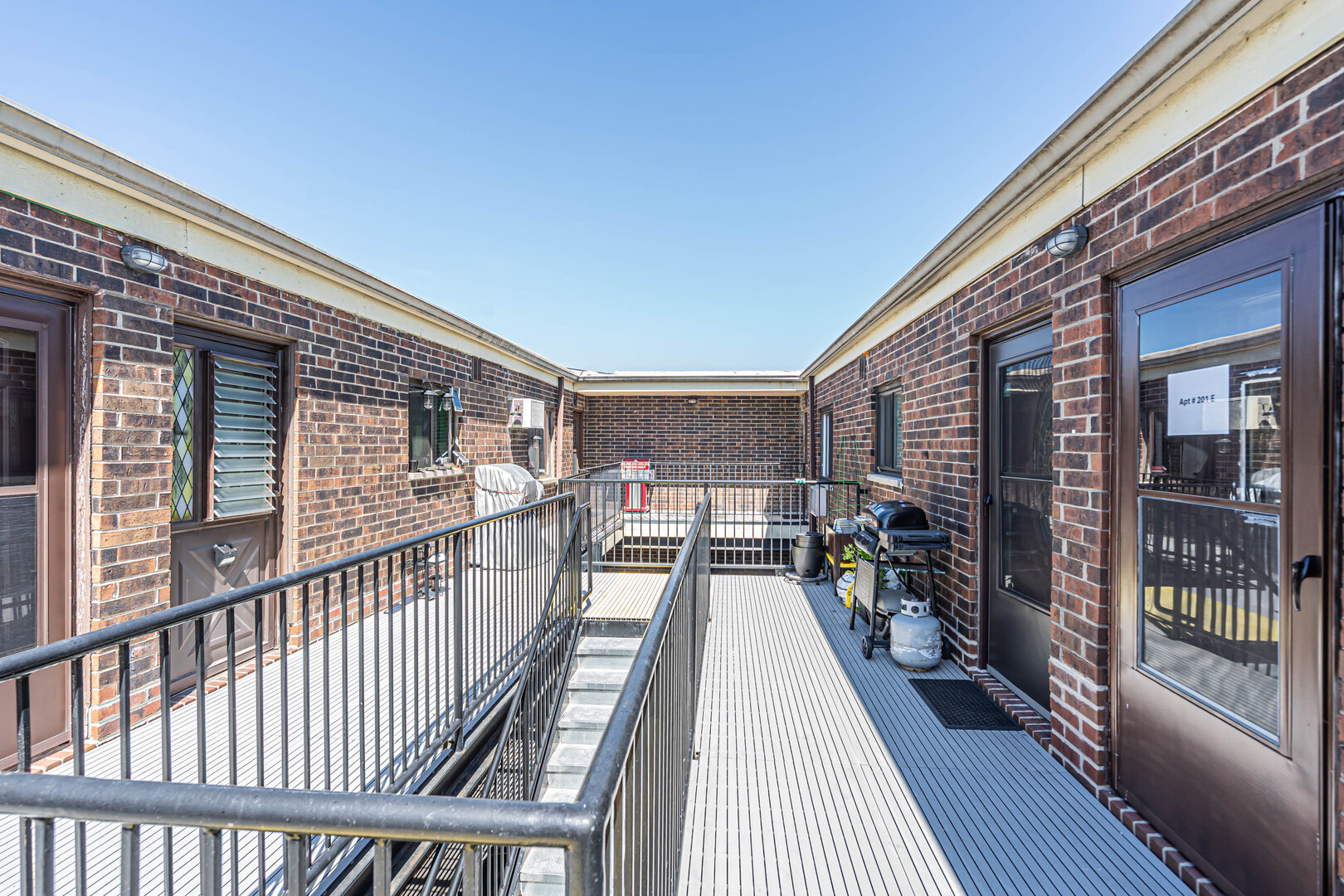 942 North Rohlwing Road, Unit 201E Addison, IL 60101 - Photo 24 of 25 a view of balcony with chairs