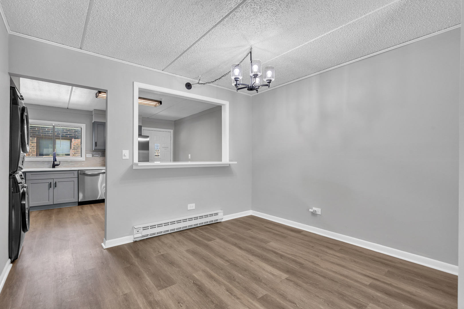 942 North Rohlwing Road, Unit 201E Addison, IL 60101 - Photo 5 of 25 wooden floor in an empty room with a window