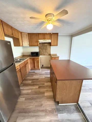 a bed room with a bed and a dresser