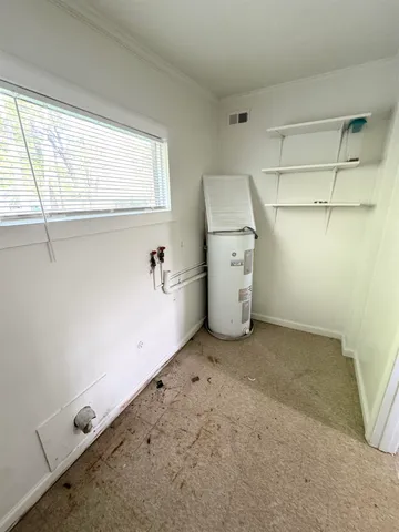 a view of a room with closet and windows
