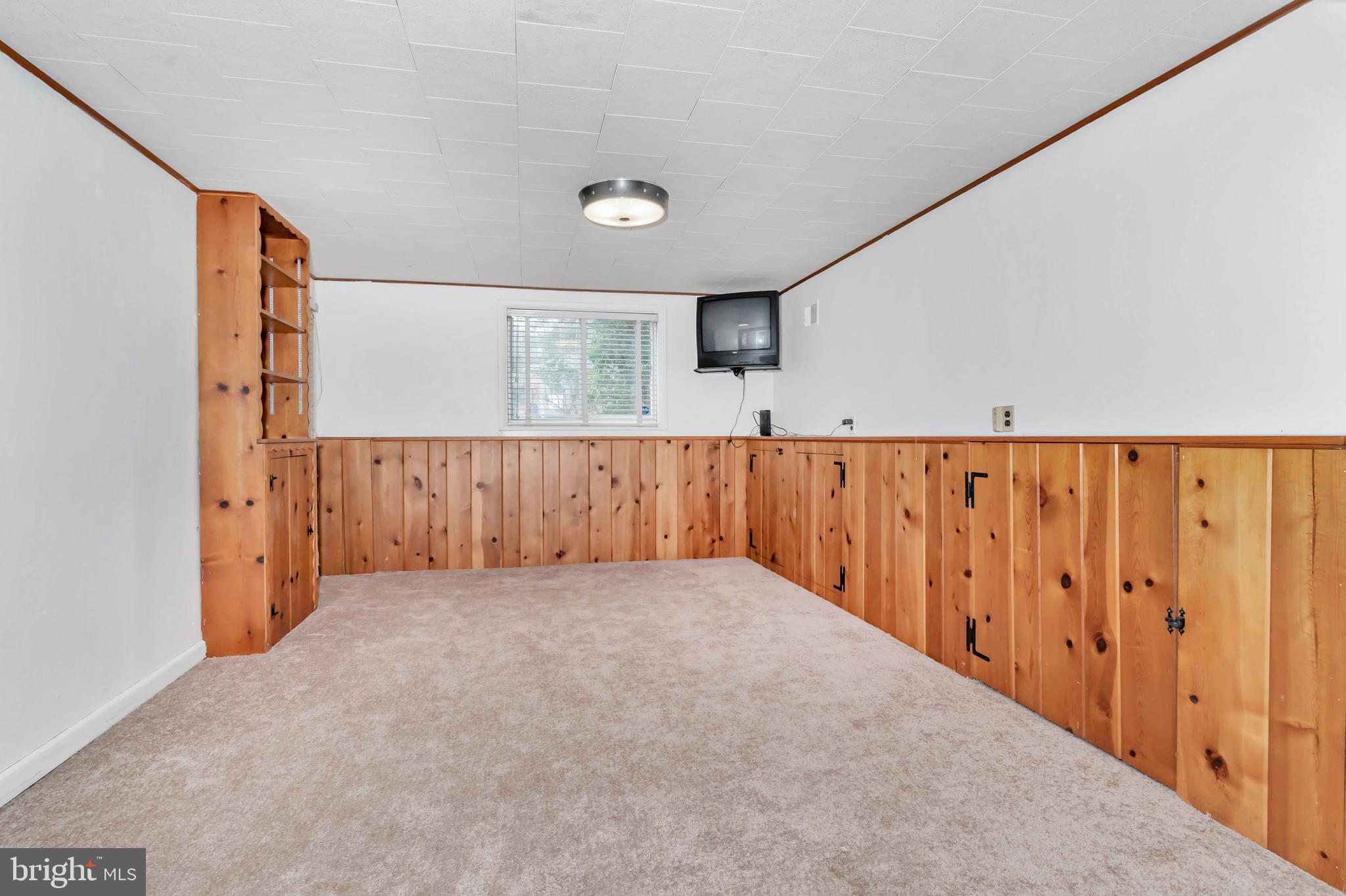 304 Pinehurst Road Wilmington, DE 19803 - Photo 25 of 34 Partially paneled family room with exterior access