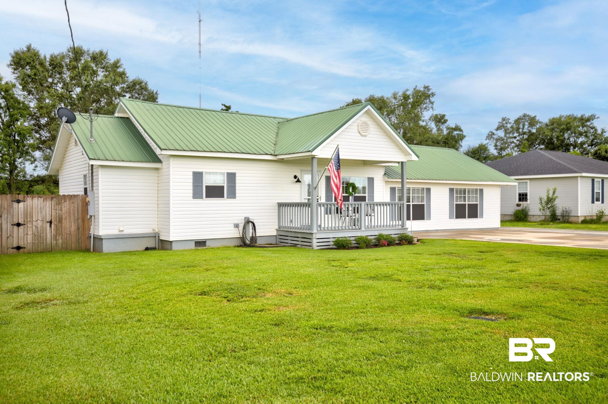 18732 Fairground Road Robertsdale, AL 36567 - Photo 3 of 46 View of front of home featuring a deck and a front lawn