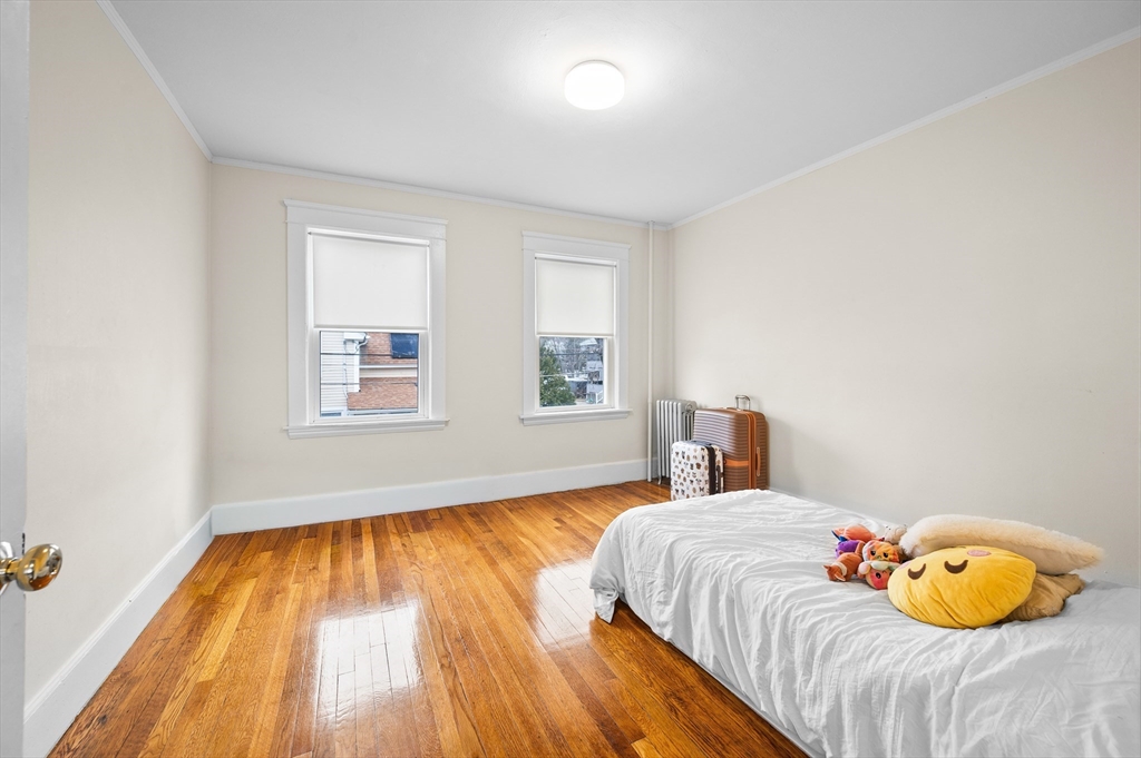 19 Oliver Street, Unit 2 Milford, MA 01757 - Photo 12 of 20 a bedroom with a bed and a window