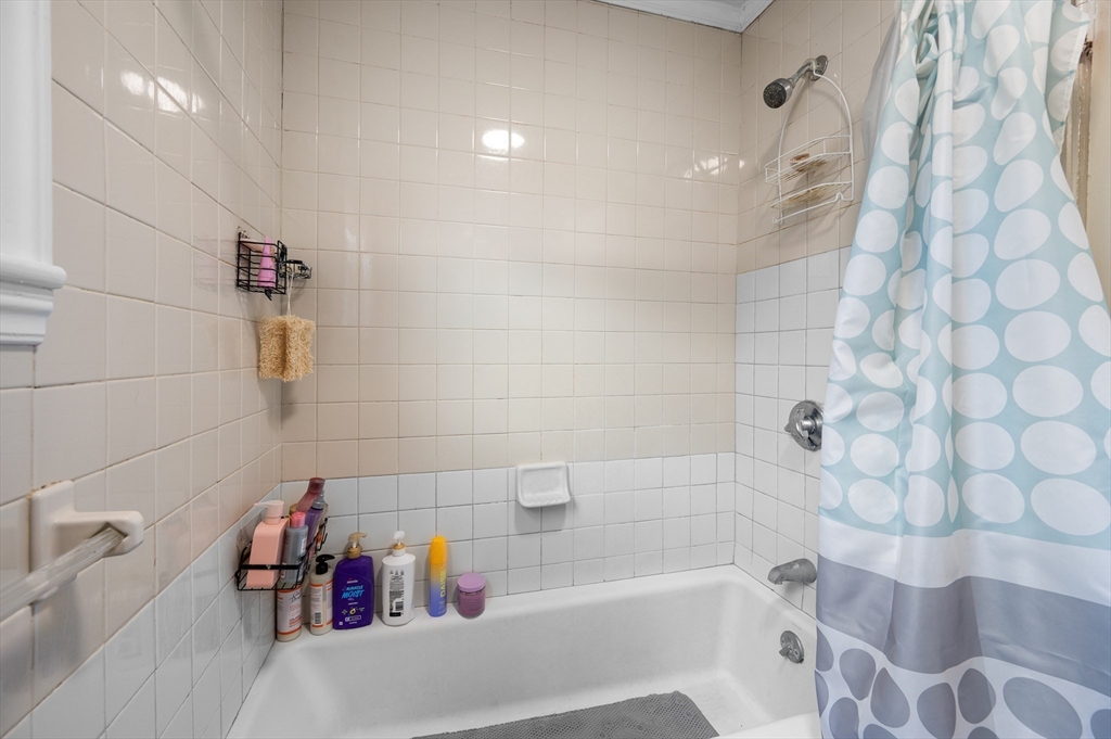 19 Oliver Street, Unit 2 Milford, MA 01757 - Photo 15 of 20 a bathroom with a bathtub and a shower