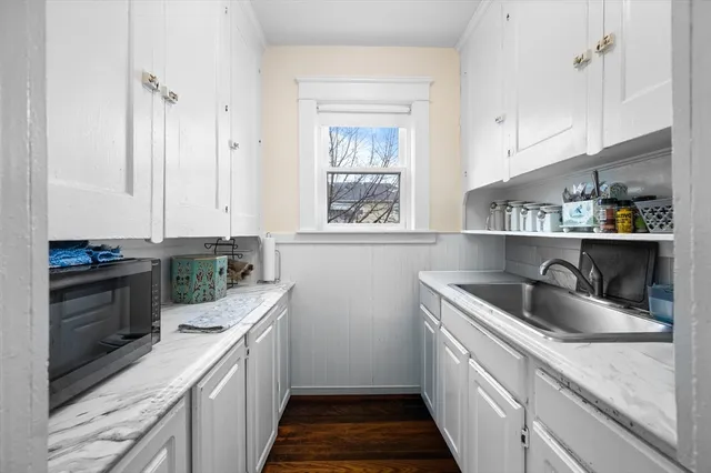 a kitchen with a sink and cabinets