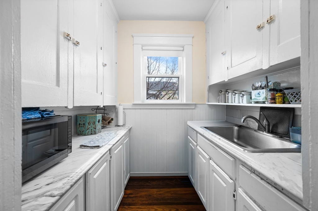 19 Oliver Street, Unit 2 Milford, MA 01757 - Photo 3 of 20 a kitchen with a sink and cabinets