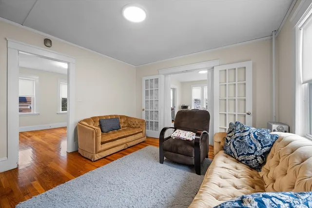 a living room with furniture window and couch