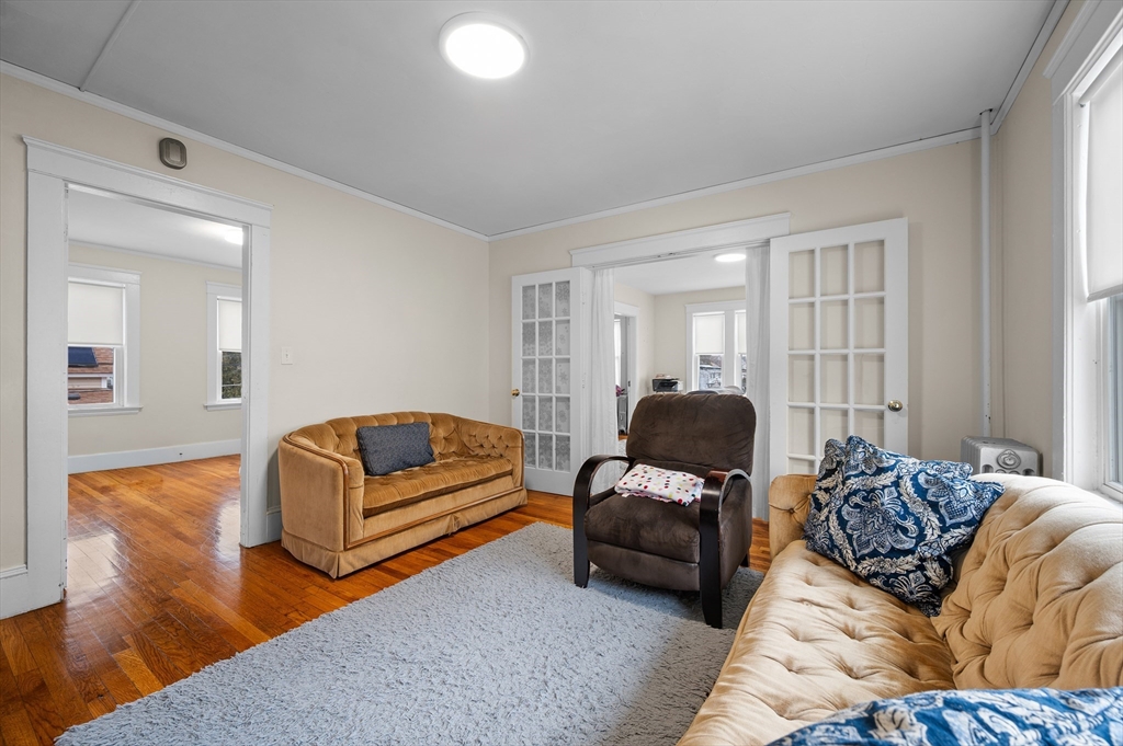 19 Oliver Street, Unit 2 Milford, MA 01757 - Photo 5 of 20 a living room with furniture window and couch