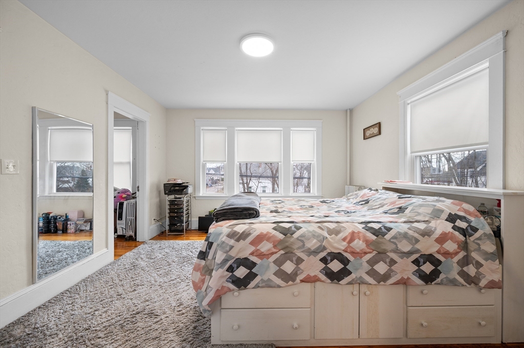 19 Oliver Street, Unit 2 Milford, MA 01757 - Photo 7 of 20 a bedroom with a large bed and a window