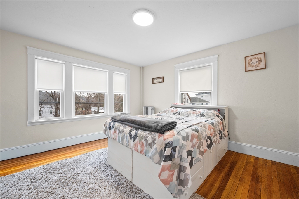 19 Oliver Street, Unit 2 Milford, MA 01757 - Photo 8 of 20 a bedroom with a bed and a window