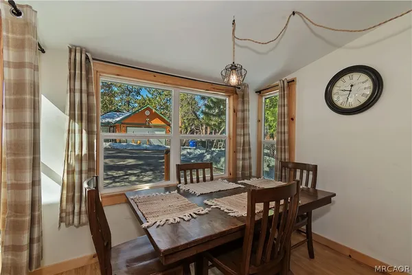 a view of a dining room with furniture window and outside view