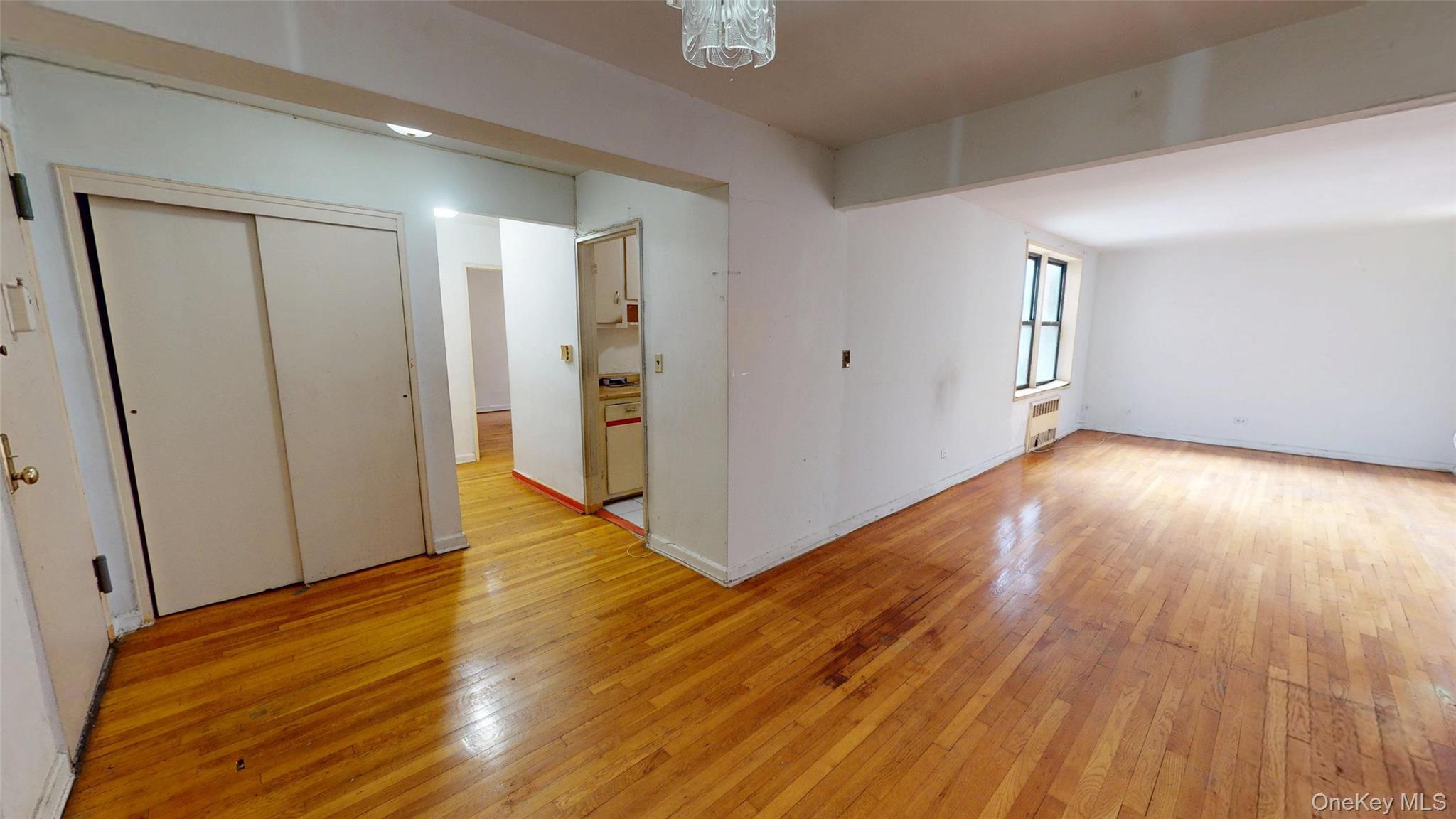 33-26 92nd Street, Unit 2T Queens, NY 11372 - Photo 2 of 10 a view of hallway with wooden floor