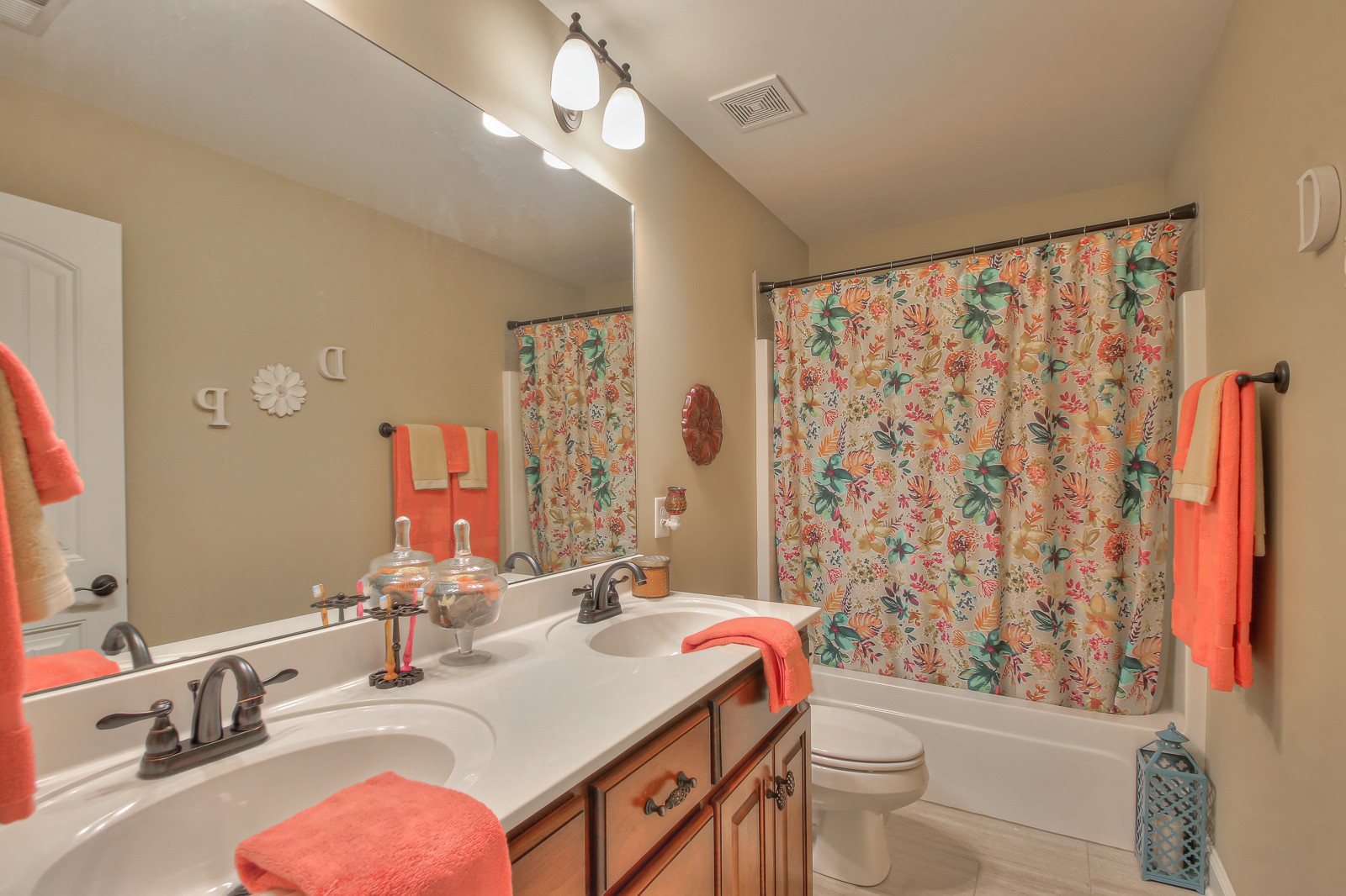1225 Rimrock Road Smyrna, TN 37167 - Photo 17 of 24 a bathroom with a granite countertop sink a toilet a mirror and shower curtain