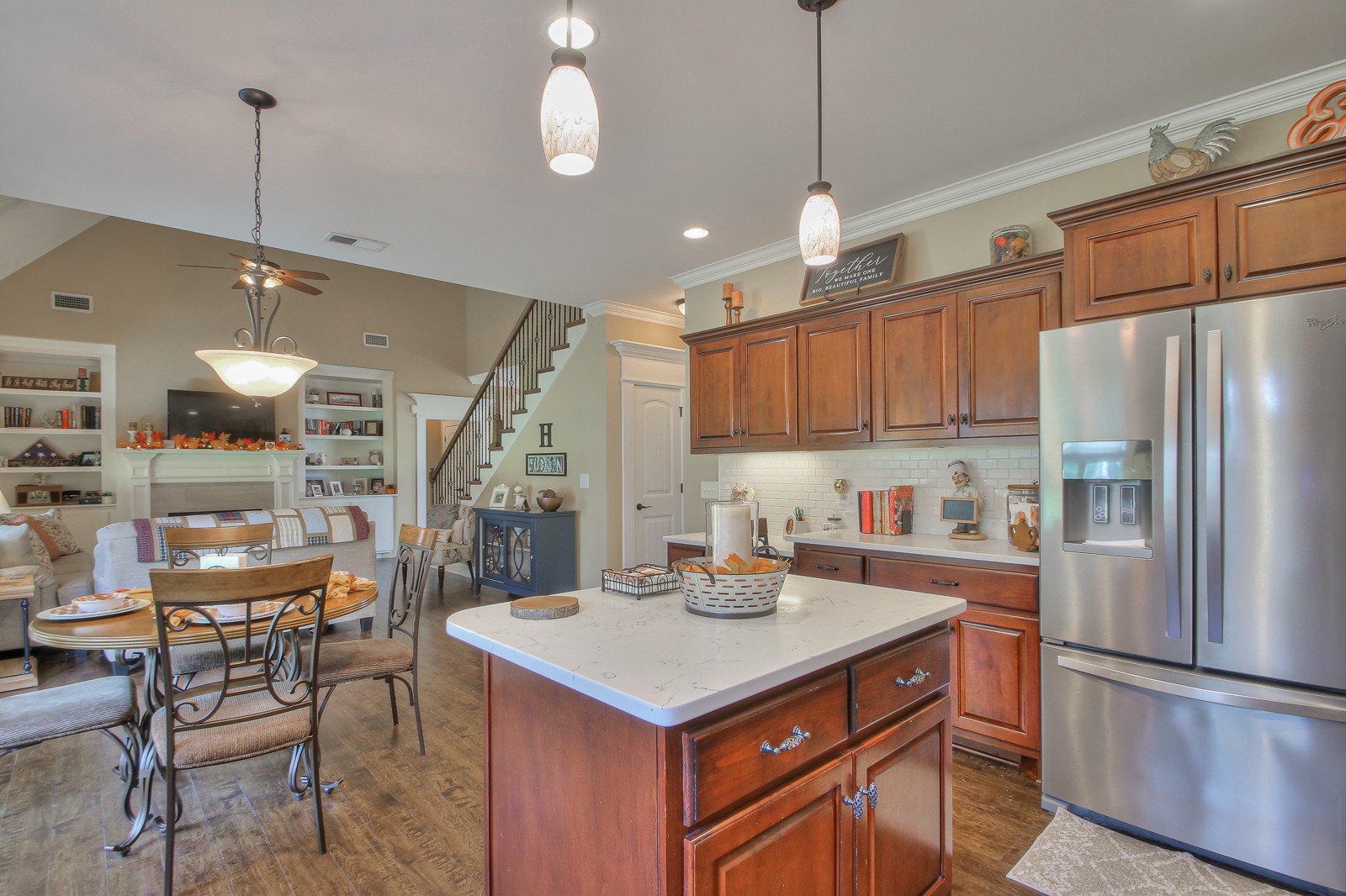 1225 Rimrock Road Smyrna, TN 37167 - Photo 5 of 24 a kitchen with a refrigerator a sink and chairs