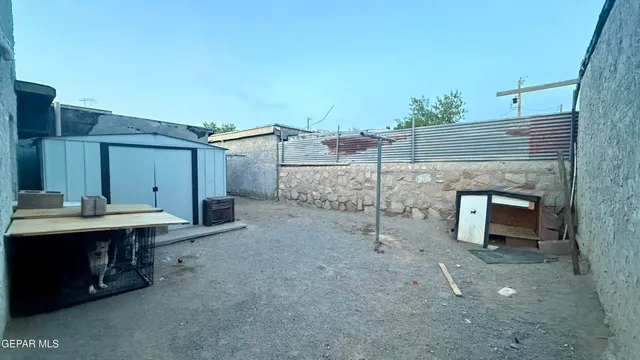 a view of a terrace with a table and chairs