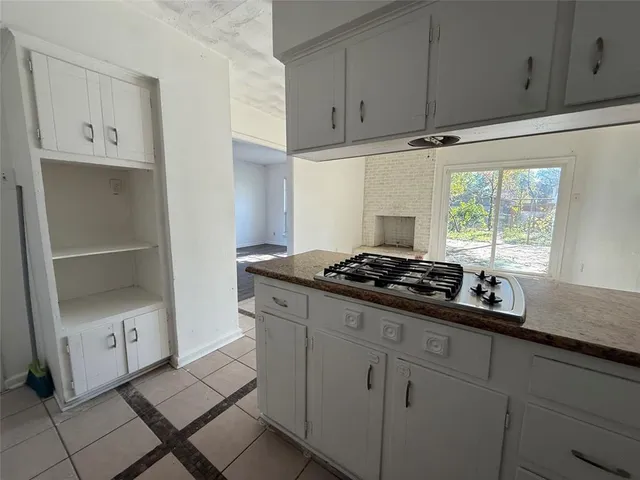 a kitchen with stainless steel appliances a stove and a refrigerator