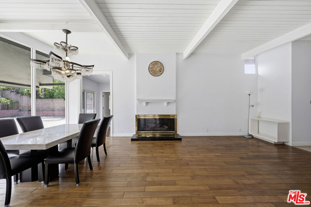 18342 Blackhawk Street Porter Ranch, CA 91326 - Photo 17 of 56 a view of a dining room with furniture window and wooden floor