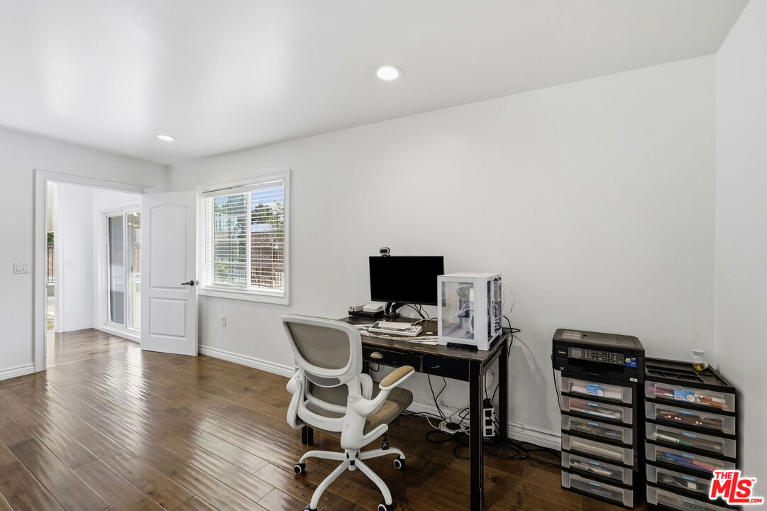 18342 Blackhawk Street Porter Ranch, CA 91326 - Photo 24 of 56 a view of a workspace with furniture and a window