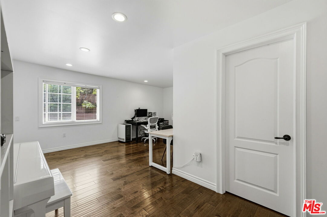 18342 Blackhawk Street Porter Ranch, CA 91326 - Photo 25 of 56 a view of a workspace with furniture and a window