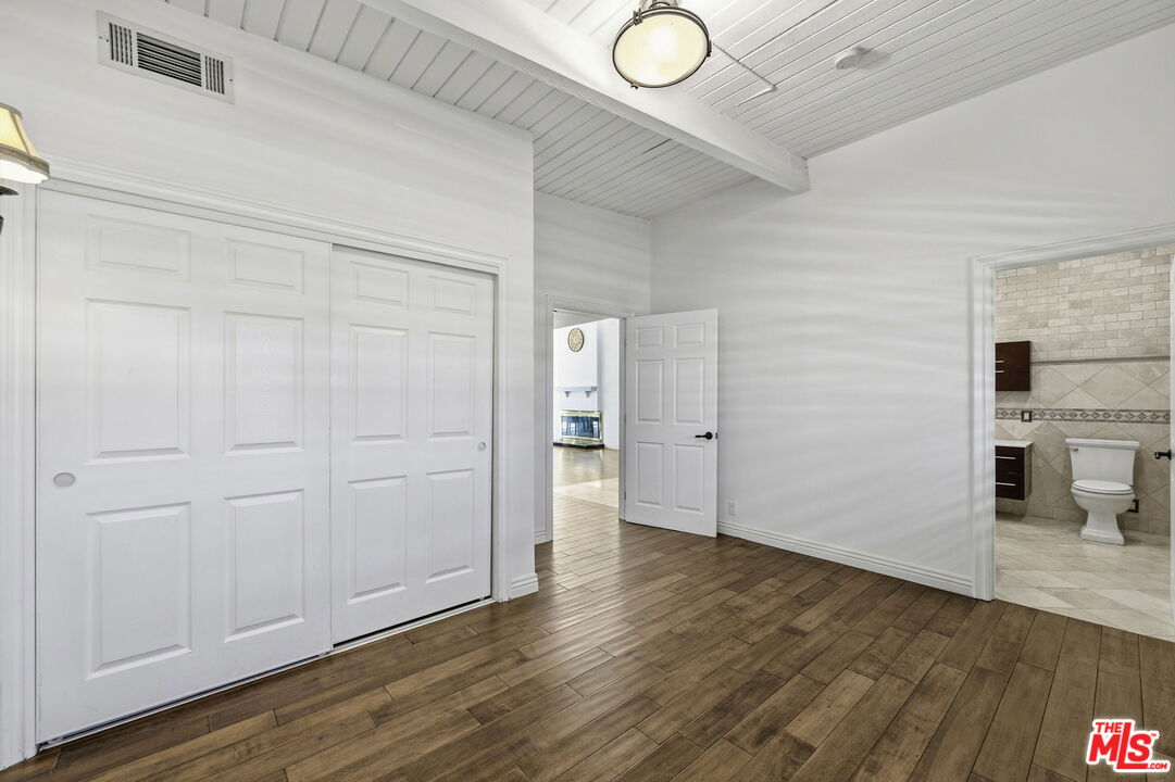 18342 Blackhawk Street Porter Ranch, CA 91326 - Photo 34 of 56 a view of a livingroom with wooden floor