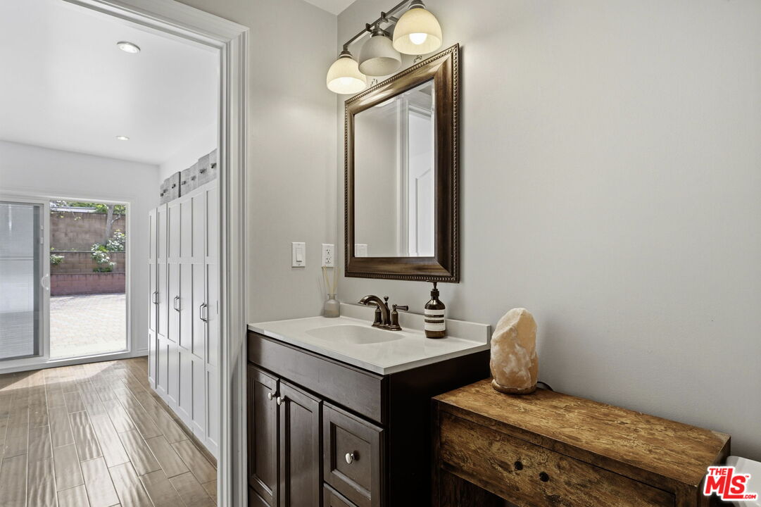 18342 Blackhawk Street Porter Ranch, CA 91326 - Photo 38 of 56 a bathroom with a sink and a mirror