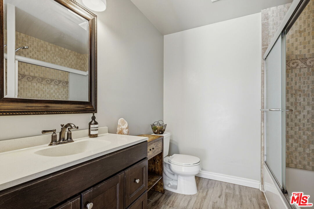 18342 Blackhawk Street Porter Ranch, CA 91326 - Photo 39 of 56 a bathroom with a sink and a mirror